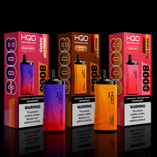 HQD Mars Peach Berry, Tobacco Coffee, and Lush Ice disposable vapes with packaging.